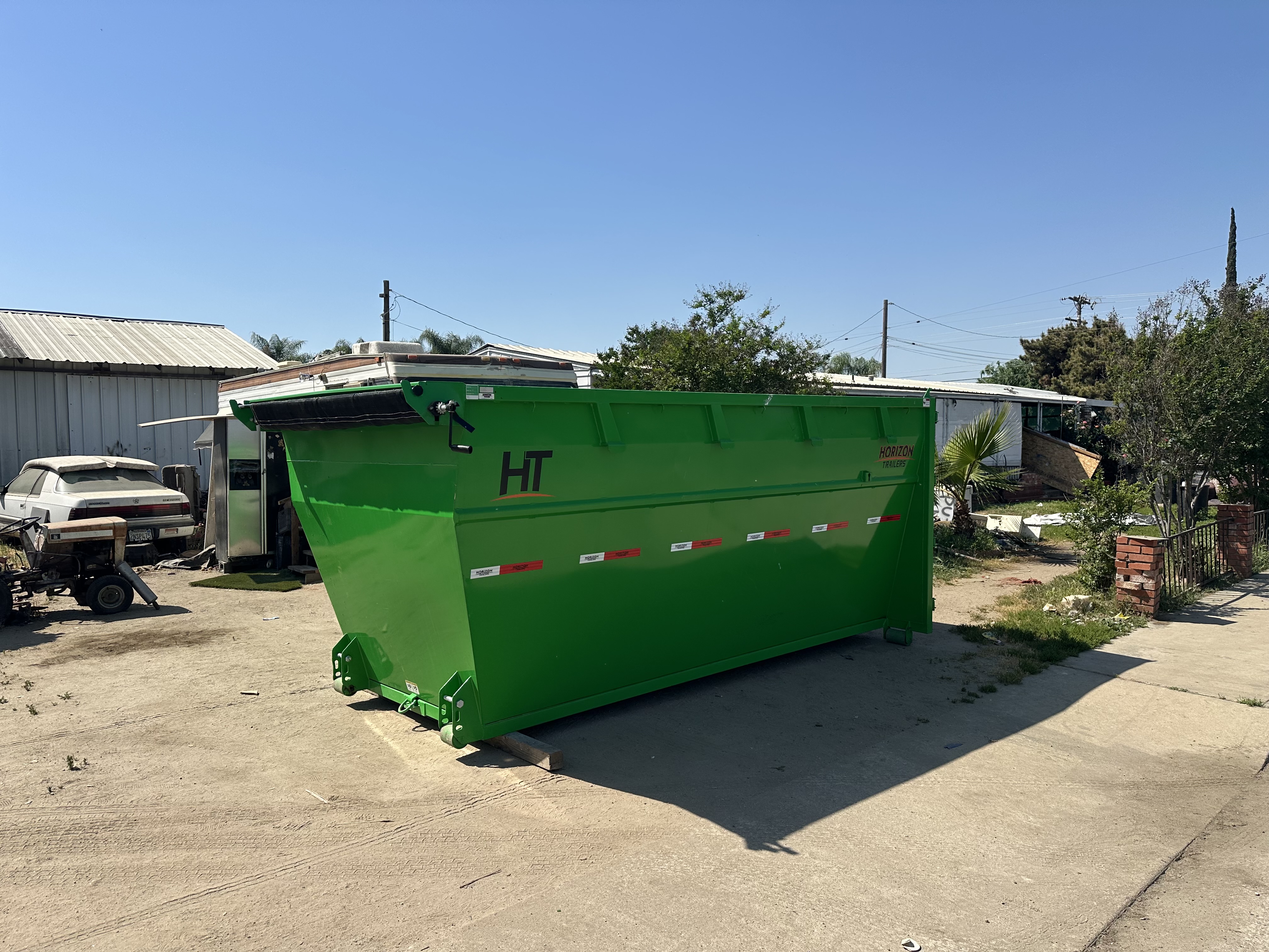 Dumpster rental in driveway