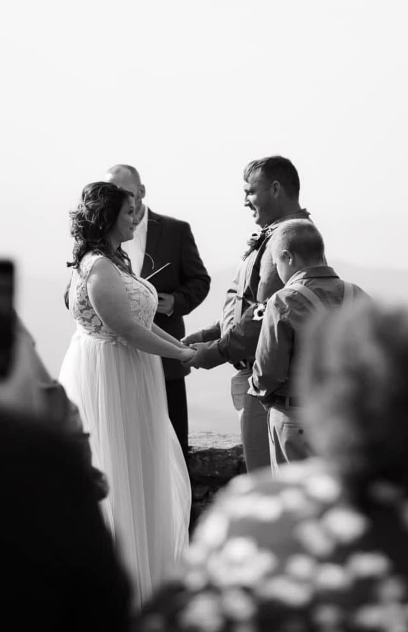 Back view couple holding hands outdoors