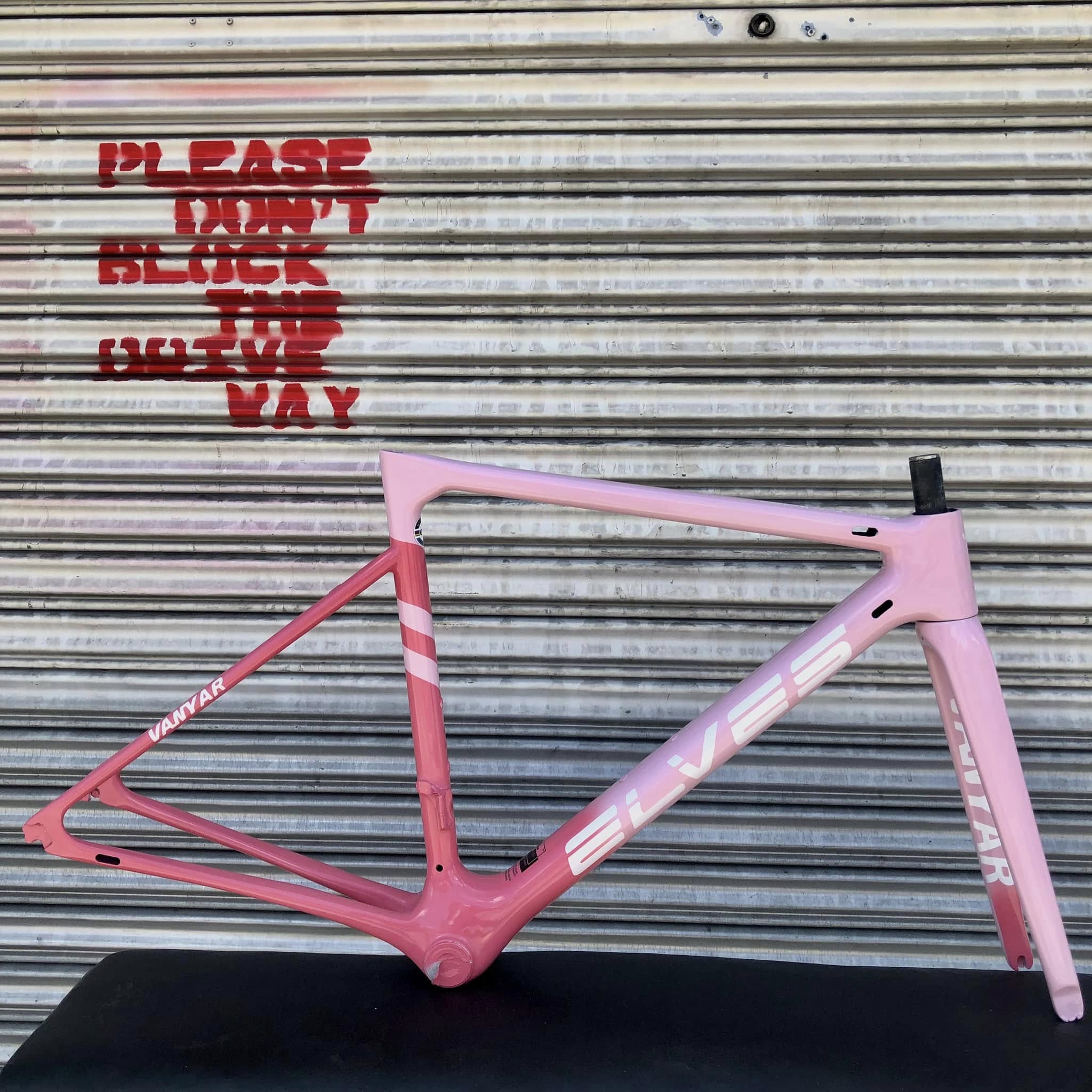 Custom painted racing bike frame with geometric patterns